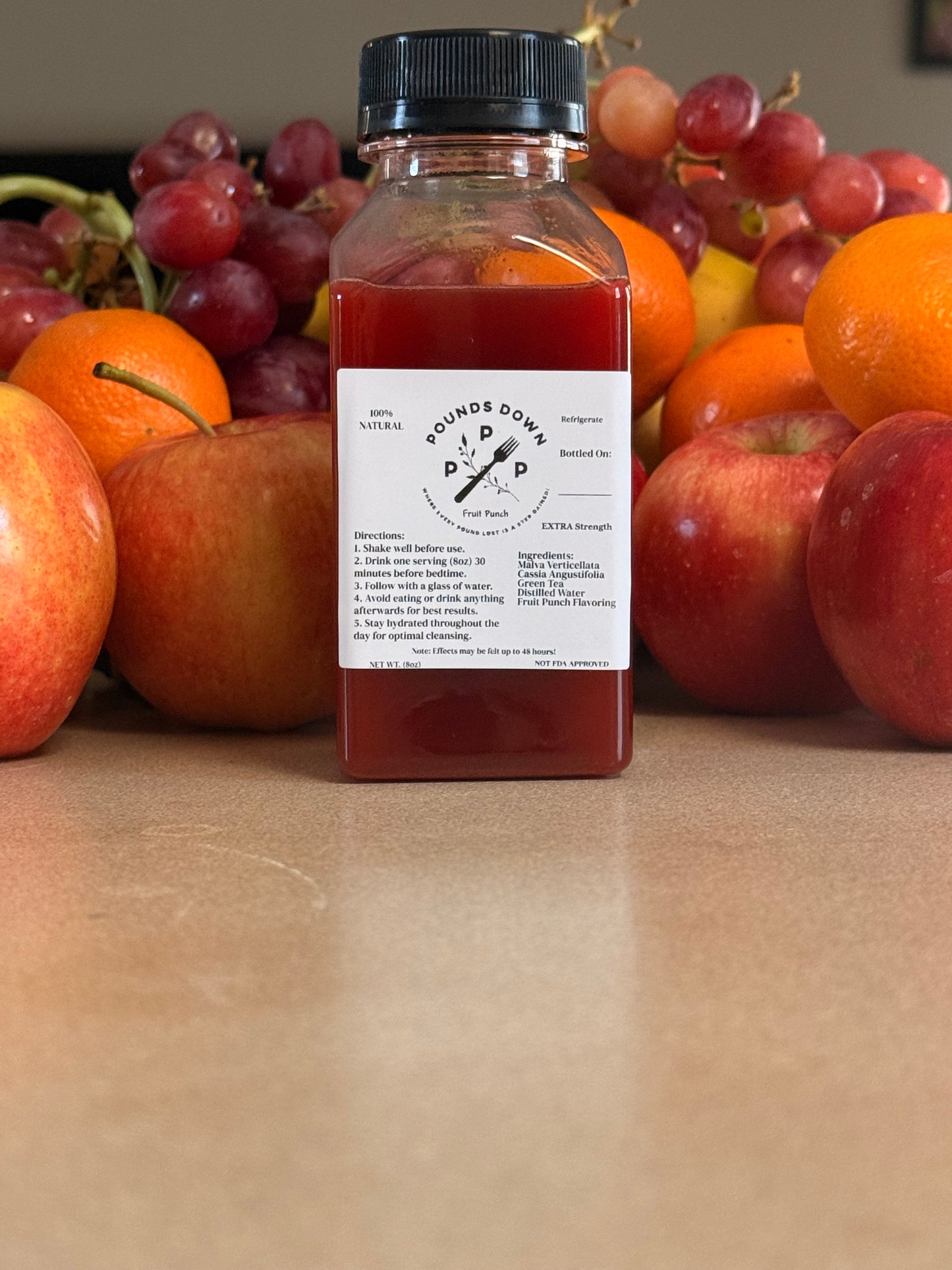 Pounds Down Extra Strength Herbal Cleanse drink in fruit punch flavor with fresh fruit, supporting digestion and daily wellness