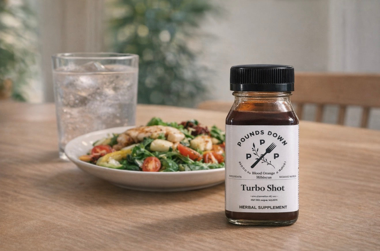 Pounds Down Turbo Shot herbal drink placed next to a healthy meal and water, showing how to use it as part of a daily wellness routine